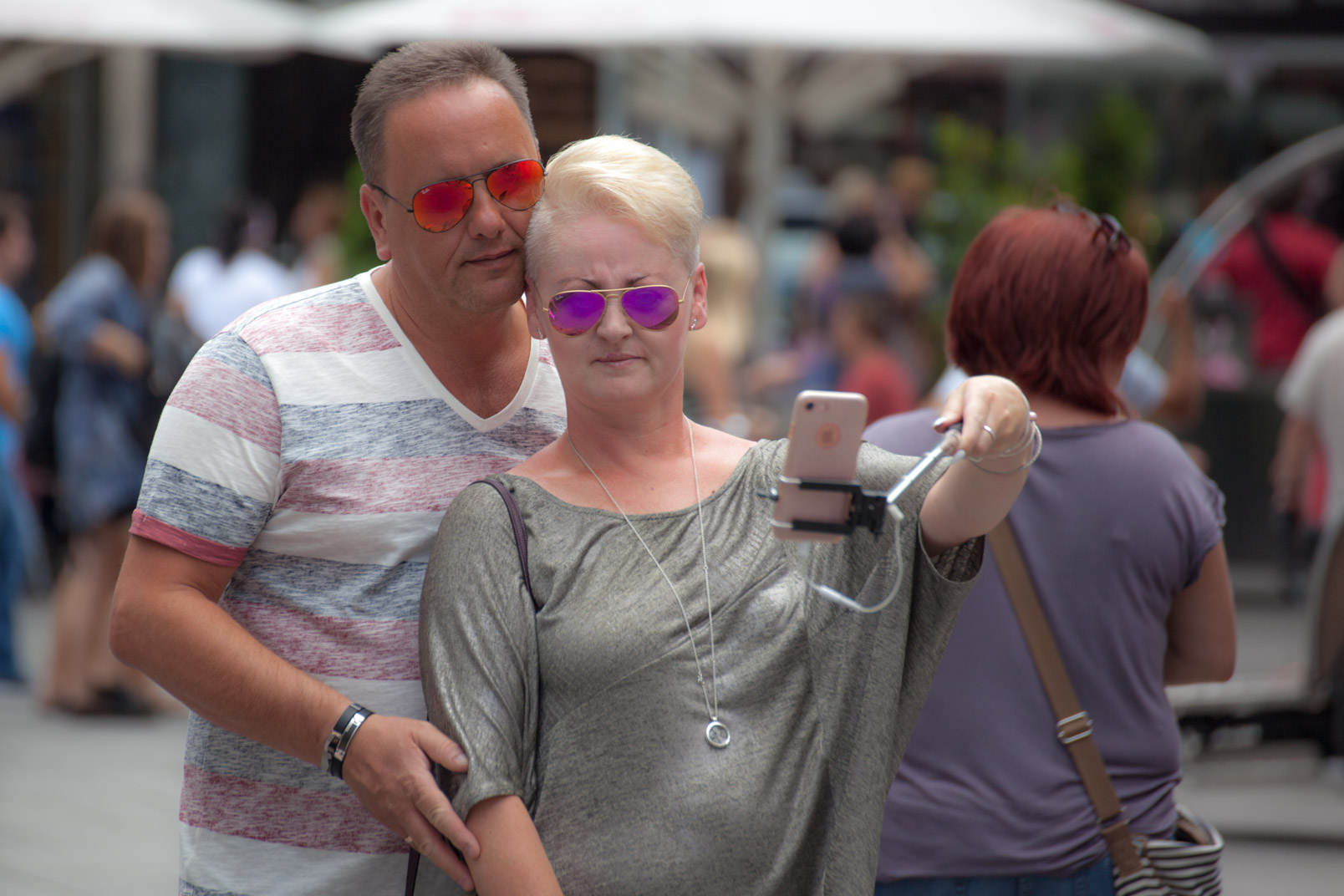Man taking selfie with woman